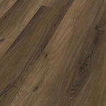 Close-up van Ambiant Avanto 90524501 Warm Brown PVC vloer - gedetailleerde houtnerf en rijke warme tinten voor een luxe uitstraling