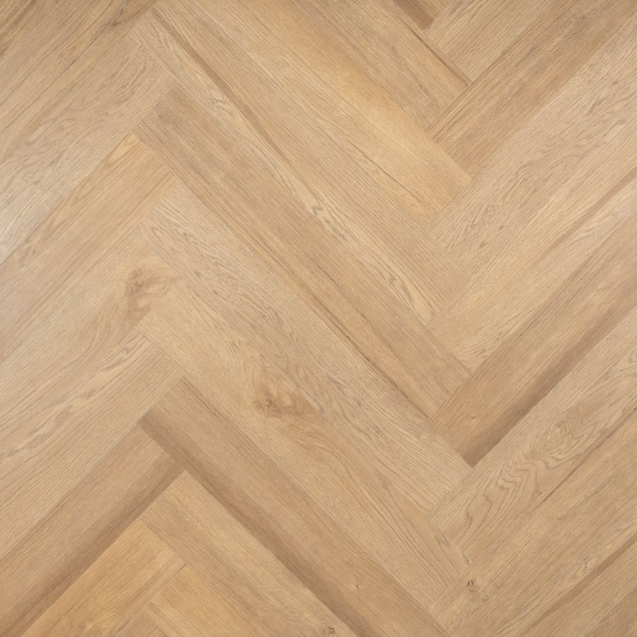Elegante Otium Herringbone Lux 94637 PVC vloer in een moderne ruimte, met een verfijnd visgraatpatroon en een luxe, warme uitstraling